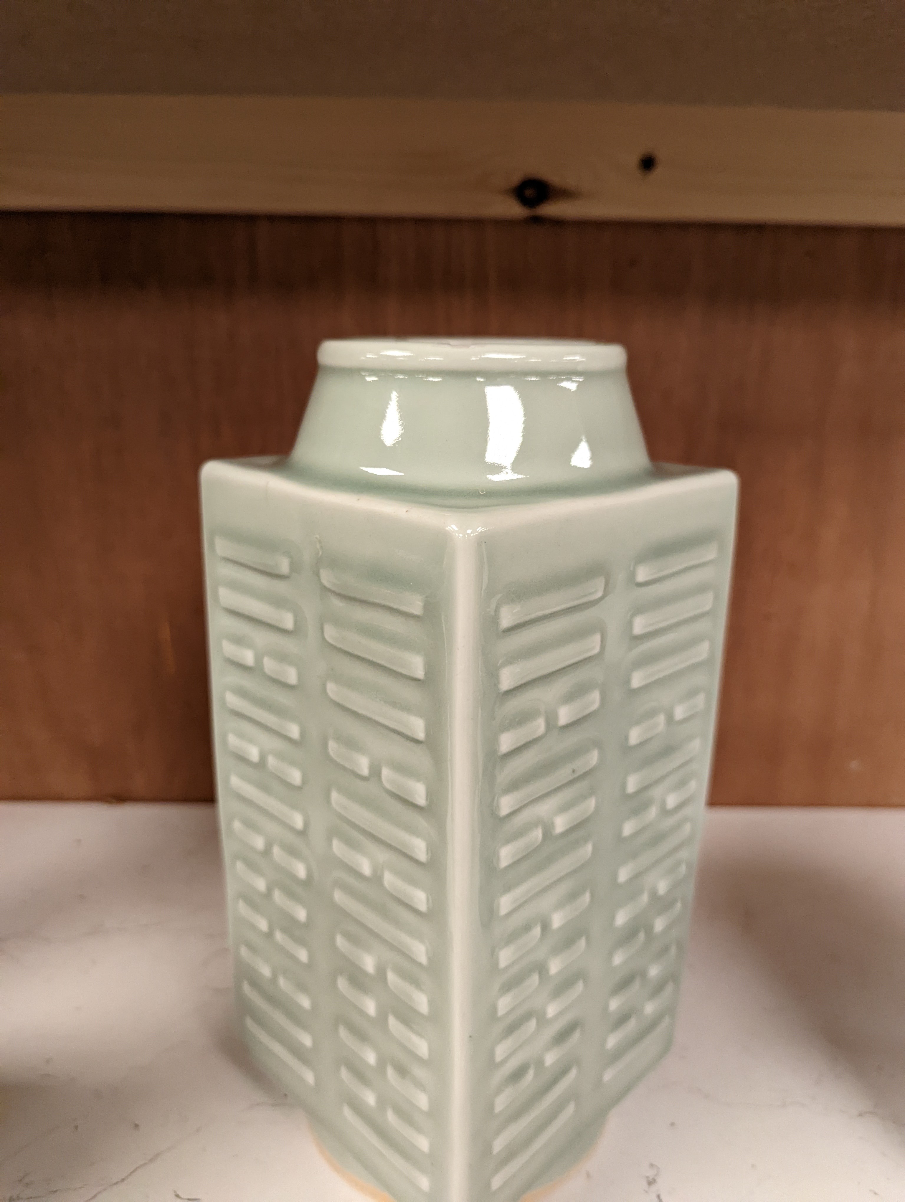 A Chinese celadon glazed eight trigrams cong shaped vase, Guangxu mark and possibly of the period. Provenance - owner bought in auction 20 years ago. 25cm tall